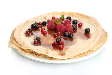 Delicious pancakes with berries and chocolate