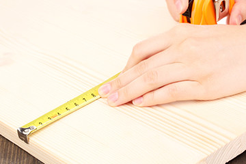 measuring wooden board close-up