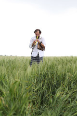 Man playing flute  for good wheat year