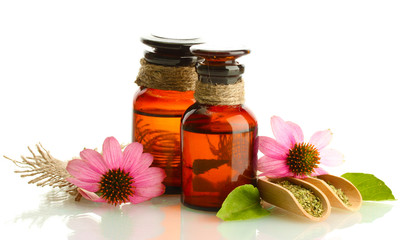 medicine bottles with purple echinacea , isolated on white