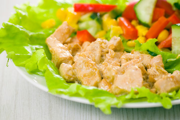 chicken breast with cheese sauce and fresh vegetable salad