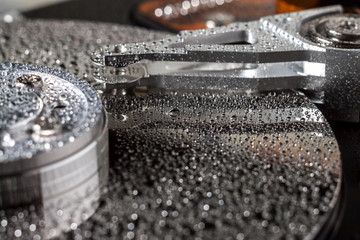 Hard disk drive with water drops.