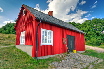 Fototapeta na wymiar Traditional red Swedish cottage house