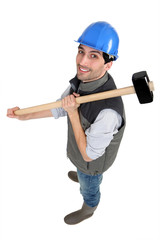 Man posing with sledge hammer