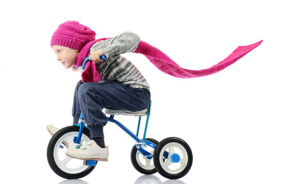 Little girl rides a bicycle on white background