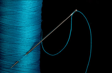 Blue thread with needle