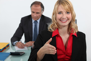 young businesswoman giving her hand for a handshake