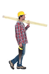 Profile of a carpenter with wood and a saw