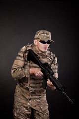 Fototapeta premium Modern soldier with rifle