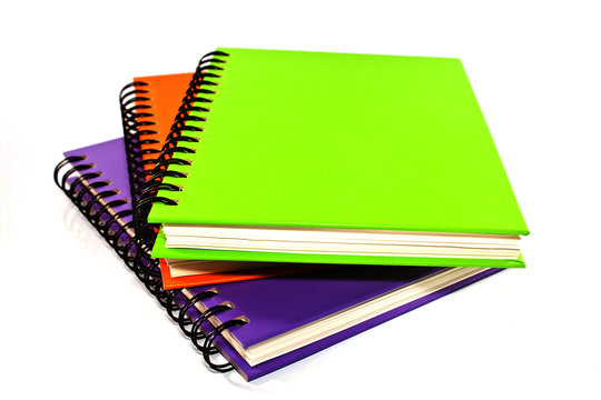 stack of ring binder book or notebook isolated on white