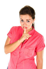 Young woman with one finger on her lips