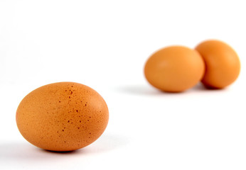 Three brown eggs