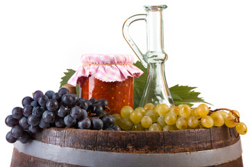 Jar of tomato with autumn vegetables and fruits