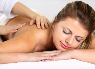Obraz premium Closeup of an attractive young woman receiving massage