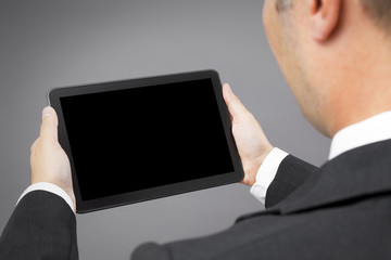 business man reading tablet pc