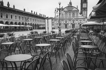 Vigevano bar tables under the rain B&W image