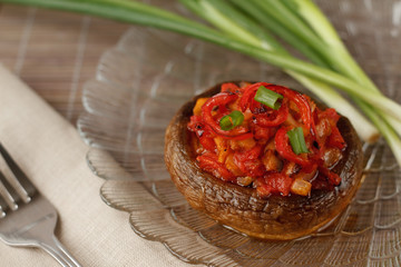 Mushroom stuffed with vegetables served with spring onion