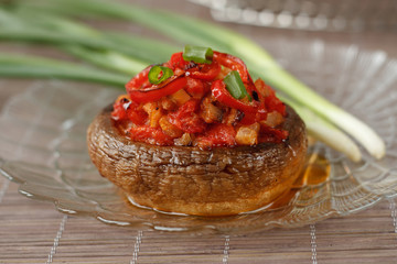 Mushroom stuffed with vegetables served with spring onion