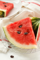 Slices of watermelon on a transparent plate