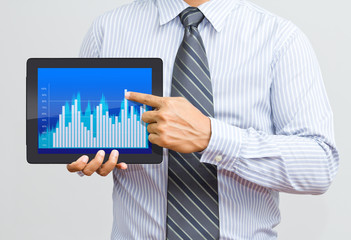 Businessman working on a digital tablet