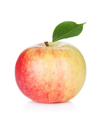 Ripe apple with green leaf