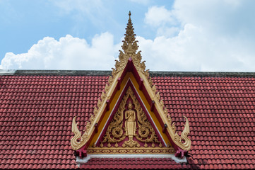 Buddha image at roof gable