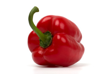 Whole red pepper isolated on white background, closeup