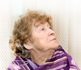 portrait of elderly happy woman dreaming