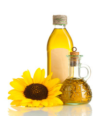 oil in jars and sunflower, isolated on white