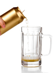 Pouring beer into glass isolated on white.