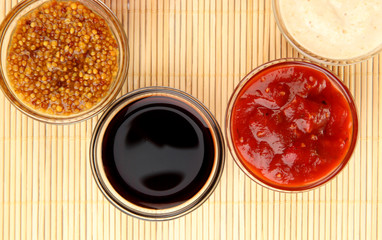 various sauces on bamboo mat