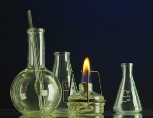 spiritlamp and test-tubes on blue background
