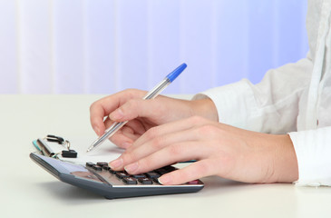 Closeup of businesswoman hands, writing on paper