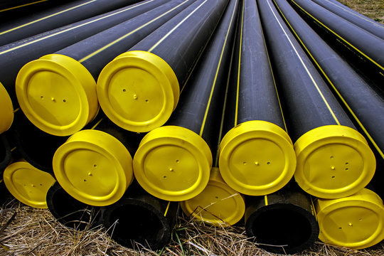 Black Plastic Pipes With Yellow Caps