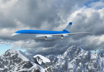 White passenger plane above the mountains