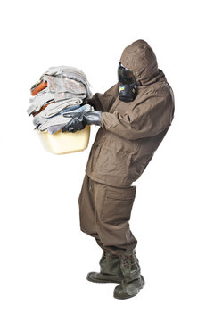 Man in Hazard Suit holding dirty towels