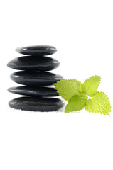 lying on mint leaf and Balanced black pebbles