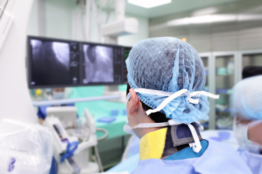 surgeon in a special uniform at work in the X-ray laboratory.