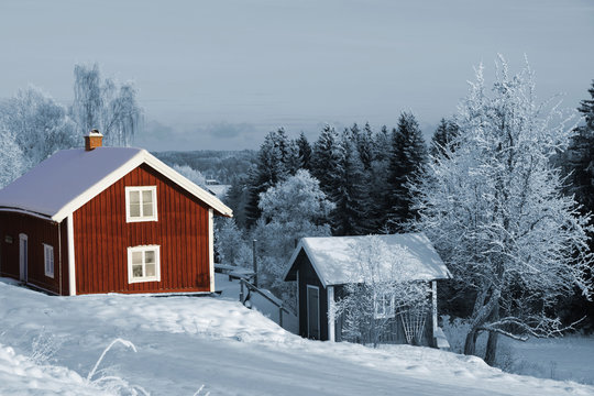 old red cottages in winter, sweden