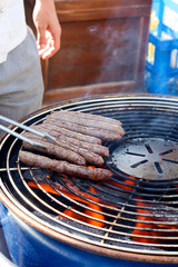 Grilling the sausages