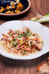 Chanterelle stewed with garlic and fresh herbs - obrazy, fototapety, plakaty