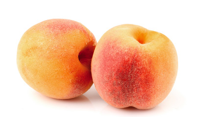 Fototapeta na wymiar Two ripe peaches