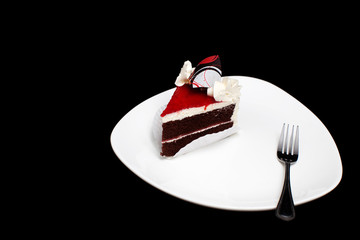 chocolate cake isolated on black background
