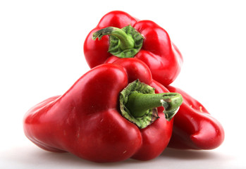 Red chilli peppers on white background.