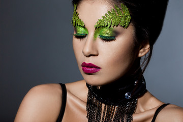 elegant fashionable woman with art visage