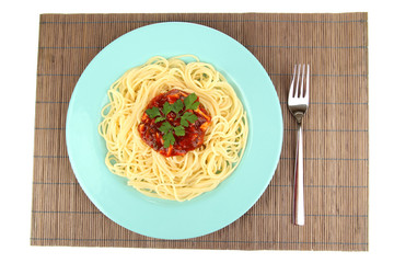 Italian spaghetti in plate on bamboo mat