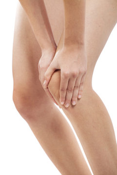 Woman with knee pain on white background