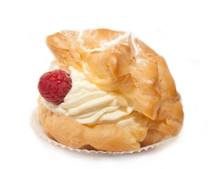 Single cream bun with raspberries, cream and vanilla powder