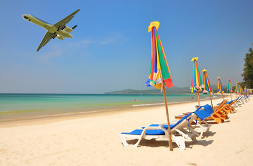 Row of sun beds at Bang Tao beach of Phuket island