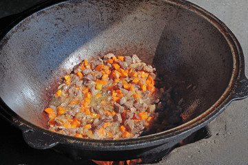 cooking in a cauldron